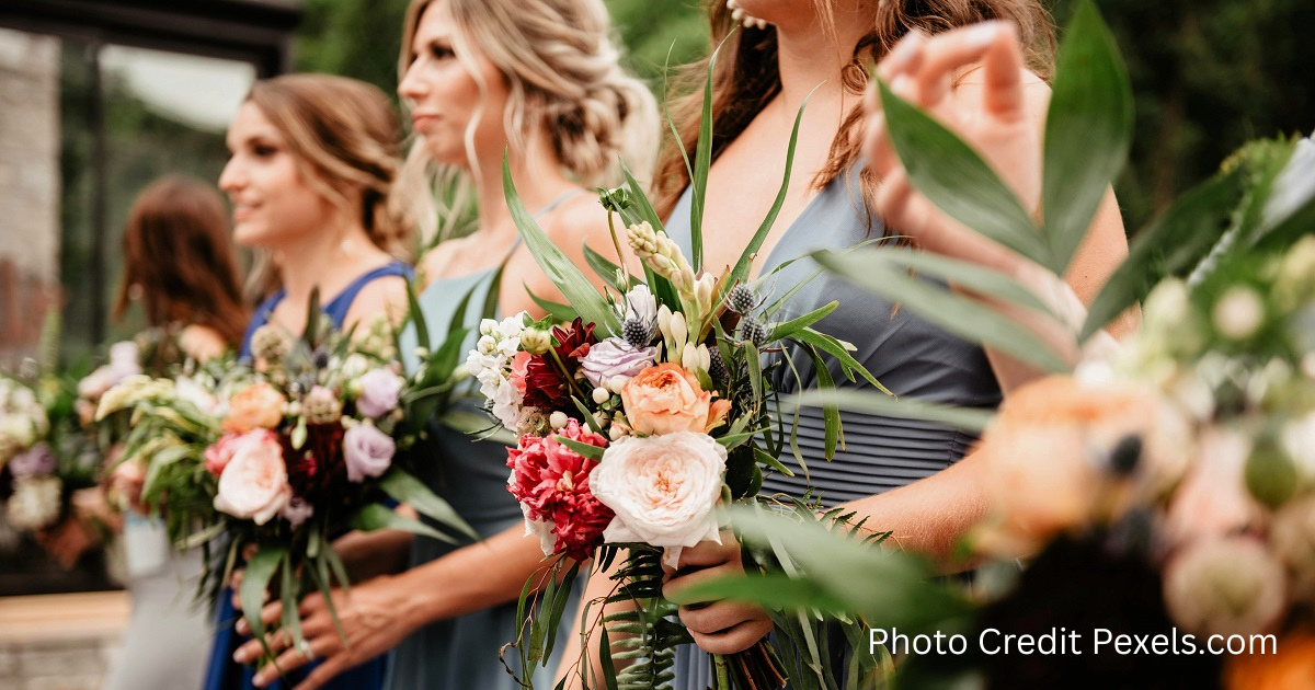 Bridesmaids line up in a row during wedding rehearsal